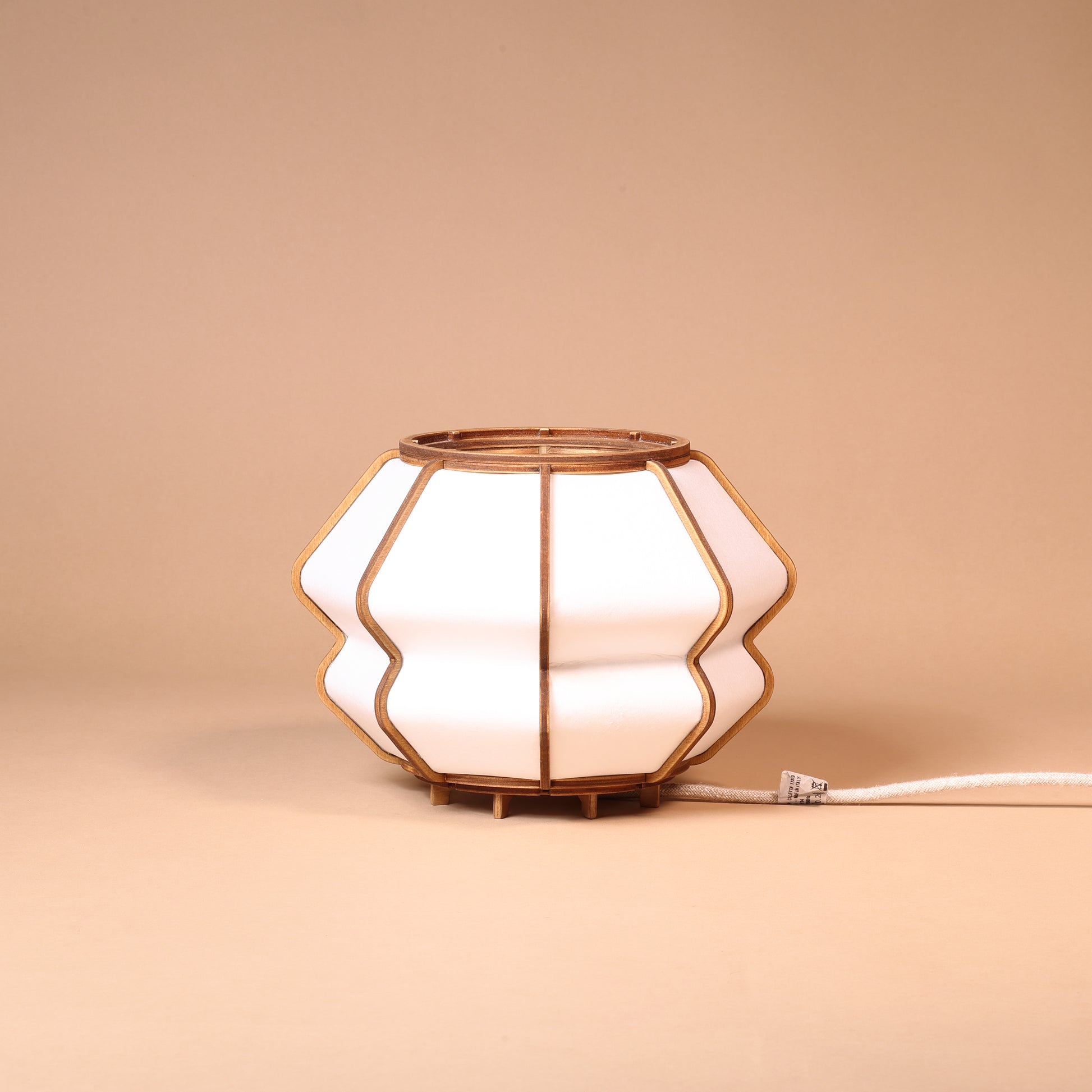 Design lamp in wood and Japanese paper, handmade, made in France. Maguelone Poulain.