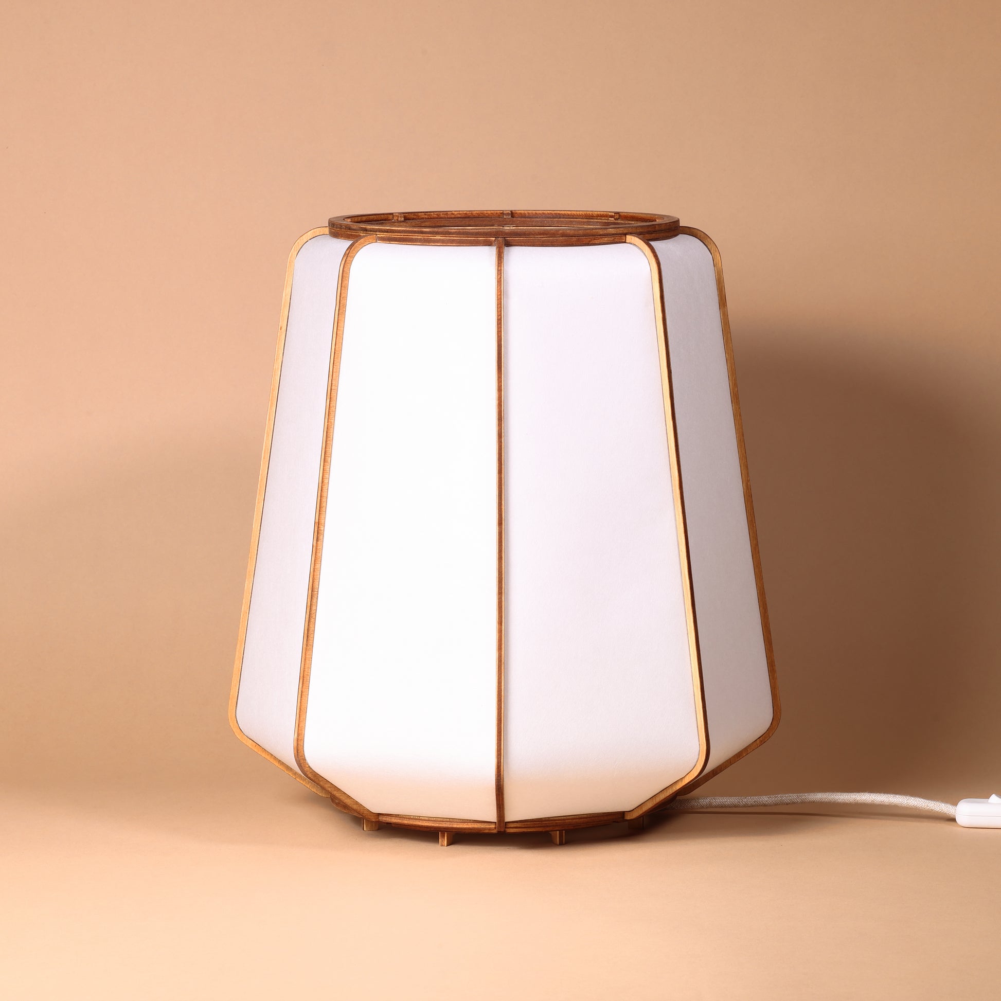 Design lamp in wood and Japanese paper, handmade, made in France. Maguelone Poulain.