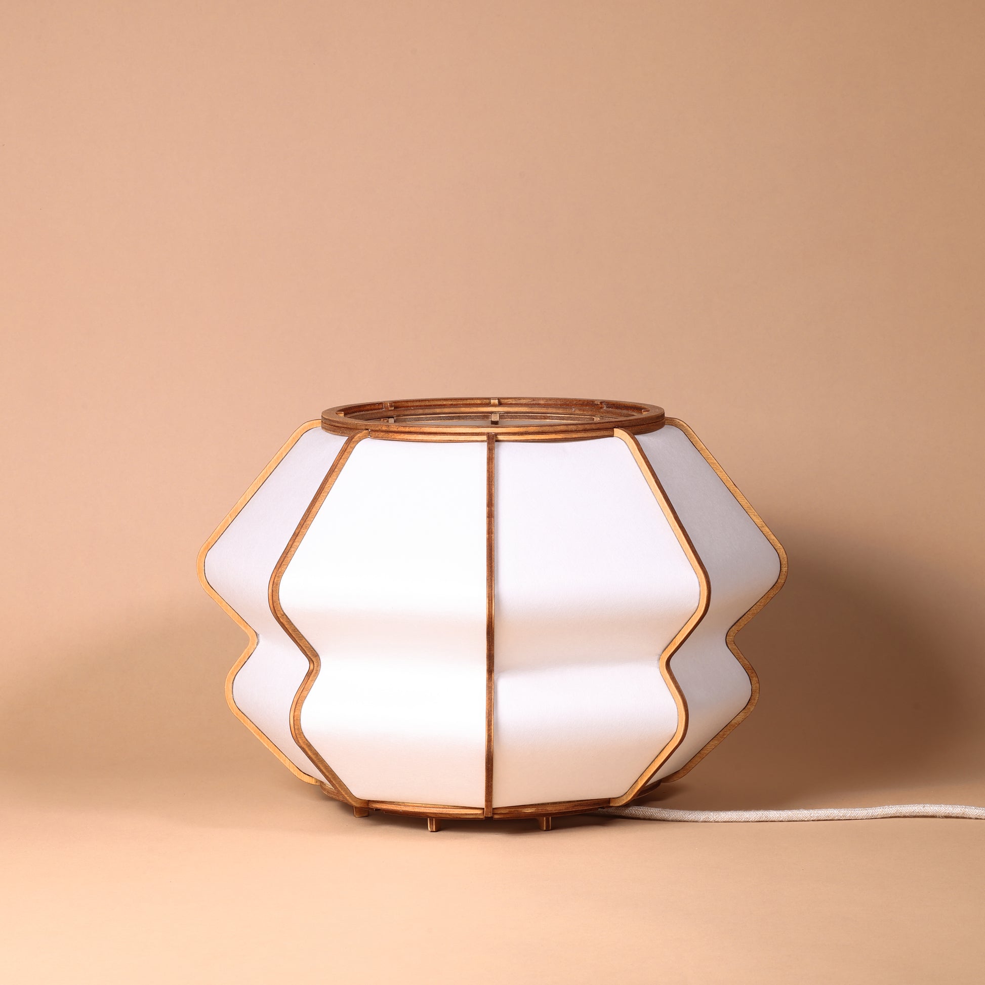Design lamp in wood and Japanese paper, handmade, made in France. Maguelone Poulain.