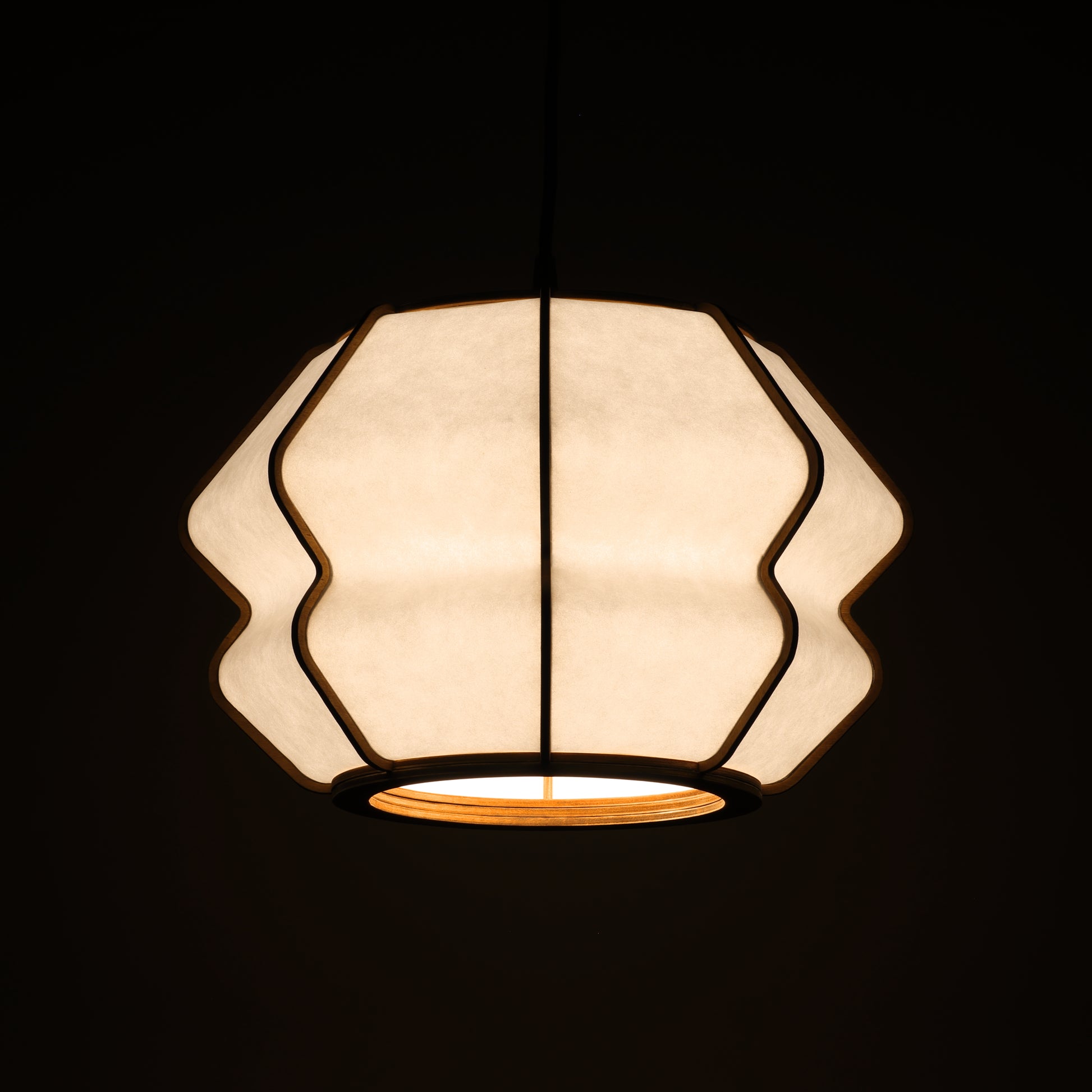 Design lamp in wood and Japanese paper, handmade, made in France. Maguelone Poulain.